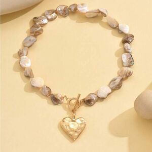 Anthropologie Pearlized Beige and Gold Heart Toggle Necklace